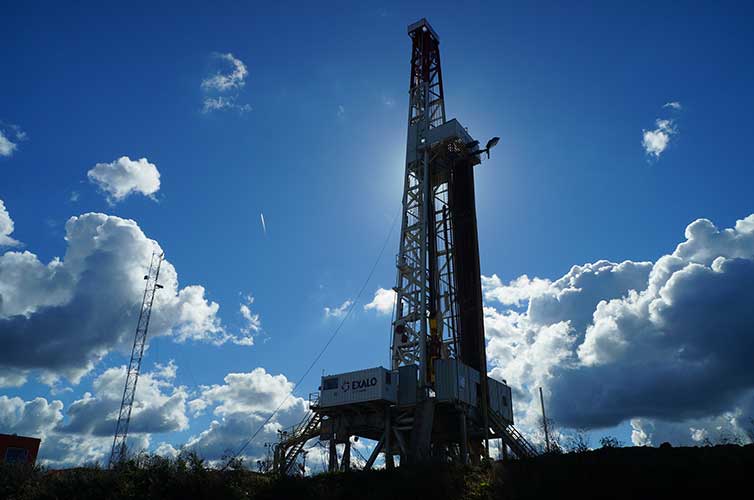 oil derrick against a blue sky